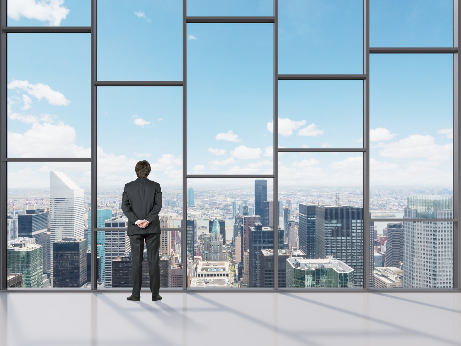 City view through large windows of a high-rise building